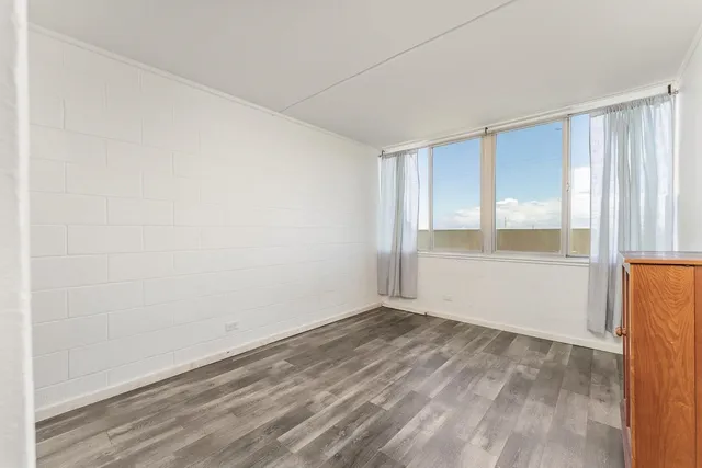 a view of an empty room with a window