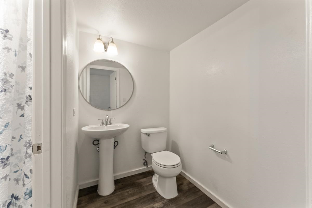 111 Kahului Beach Road, Unit A104 Kahului, HI 96732 - Photo 29 of 38 a bathroom with a toilet sink and mirror