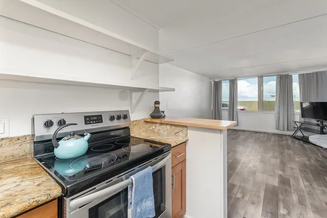 a kitchen with a stove and a refrigerator