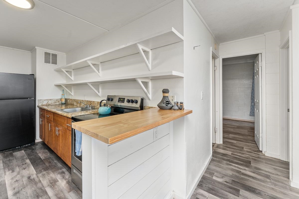 111 Kahului Beach Road, Unit A104 Kahului, HI 96732 - Photo 8 of 38 a kitchen view with wooden floor