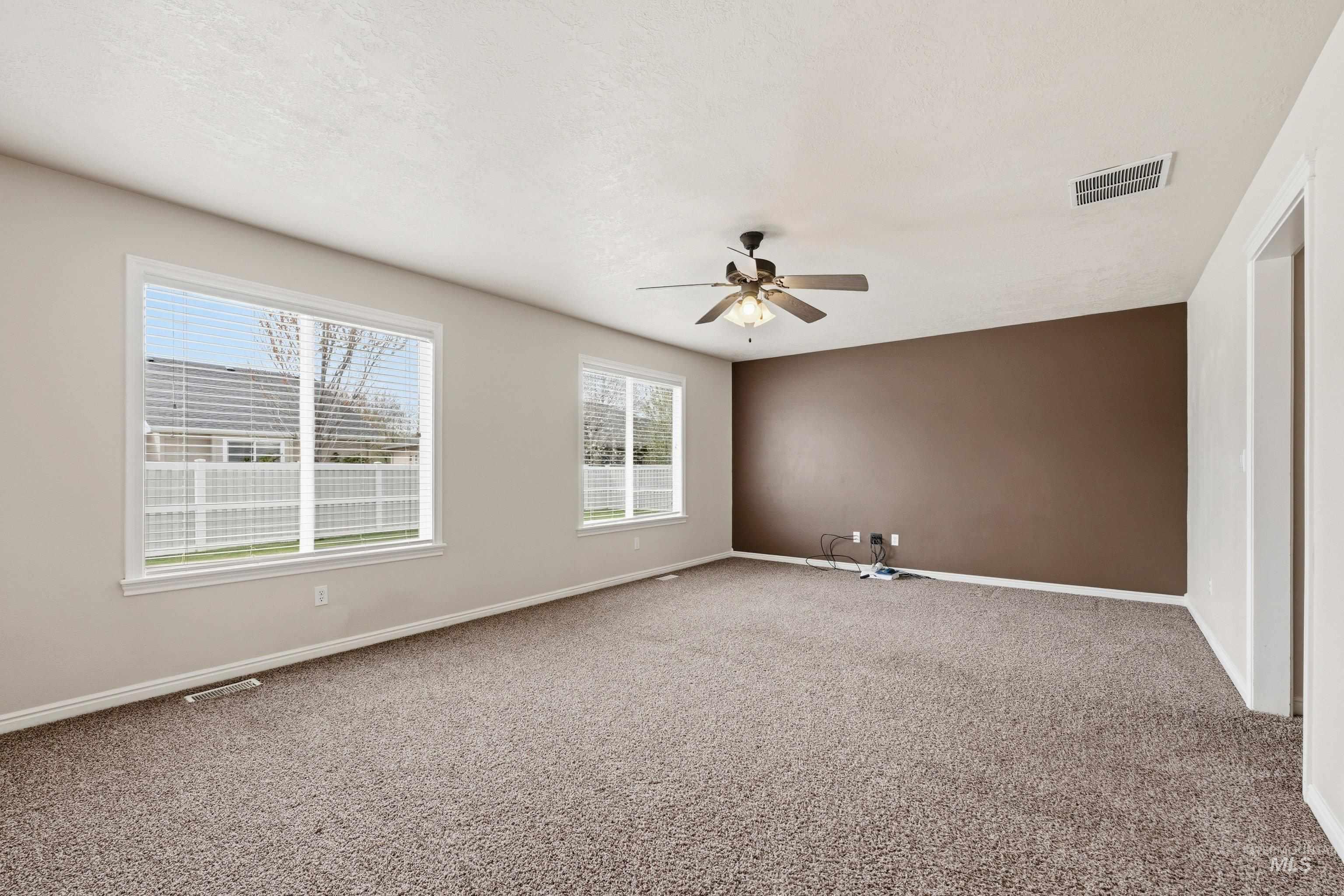 3787 North Alexis Way Meridian, ID 83646 - Photo 23 of 50 Spare room featuring ceiling fan and carpet floors