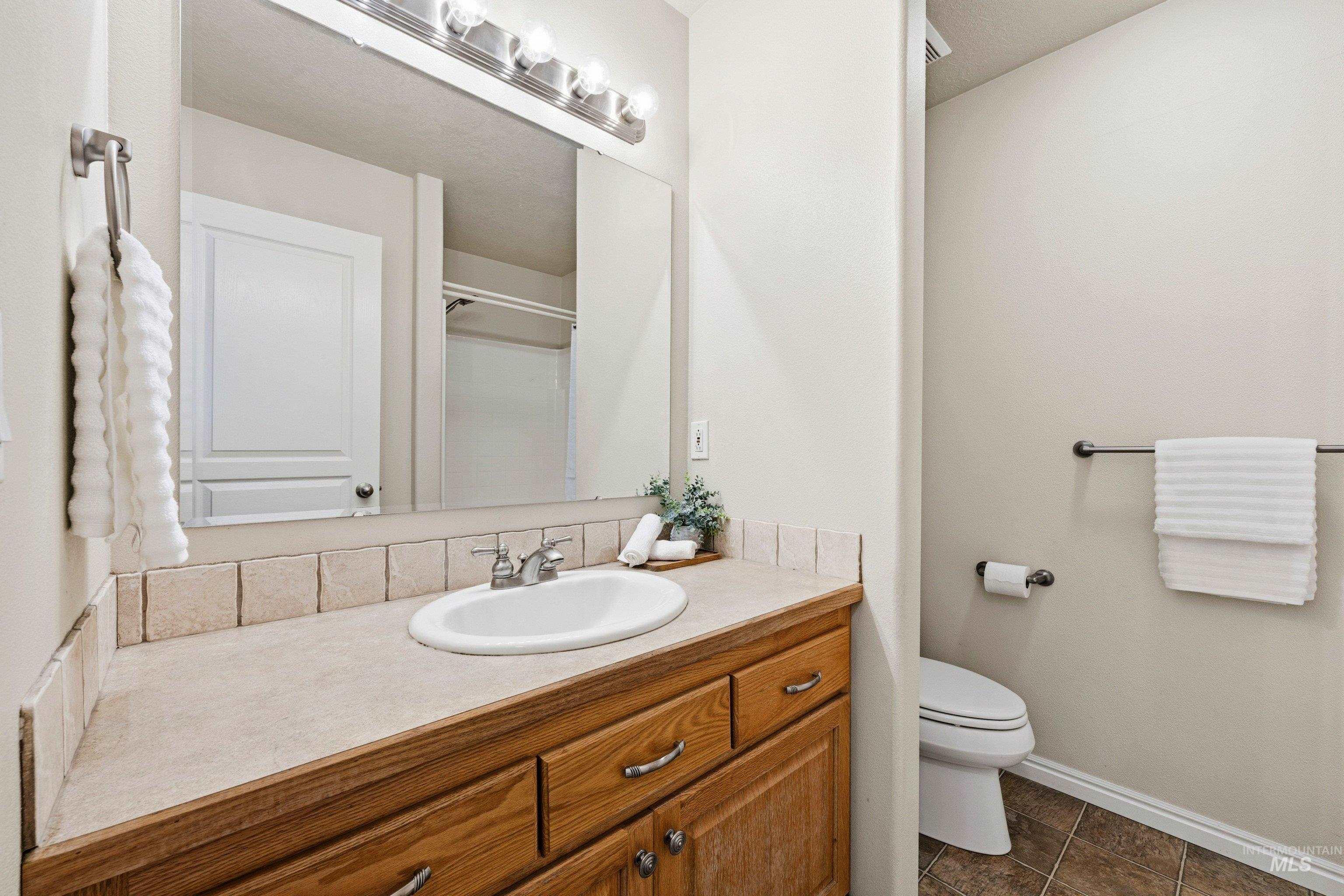 3787 North Alexis Way Meridian, ID 83646 - Photo 27 of 50 Bathroom with vanity and baseboards