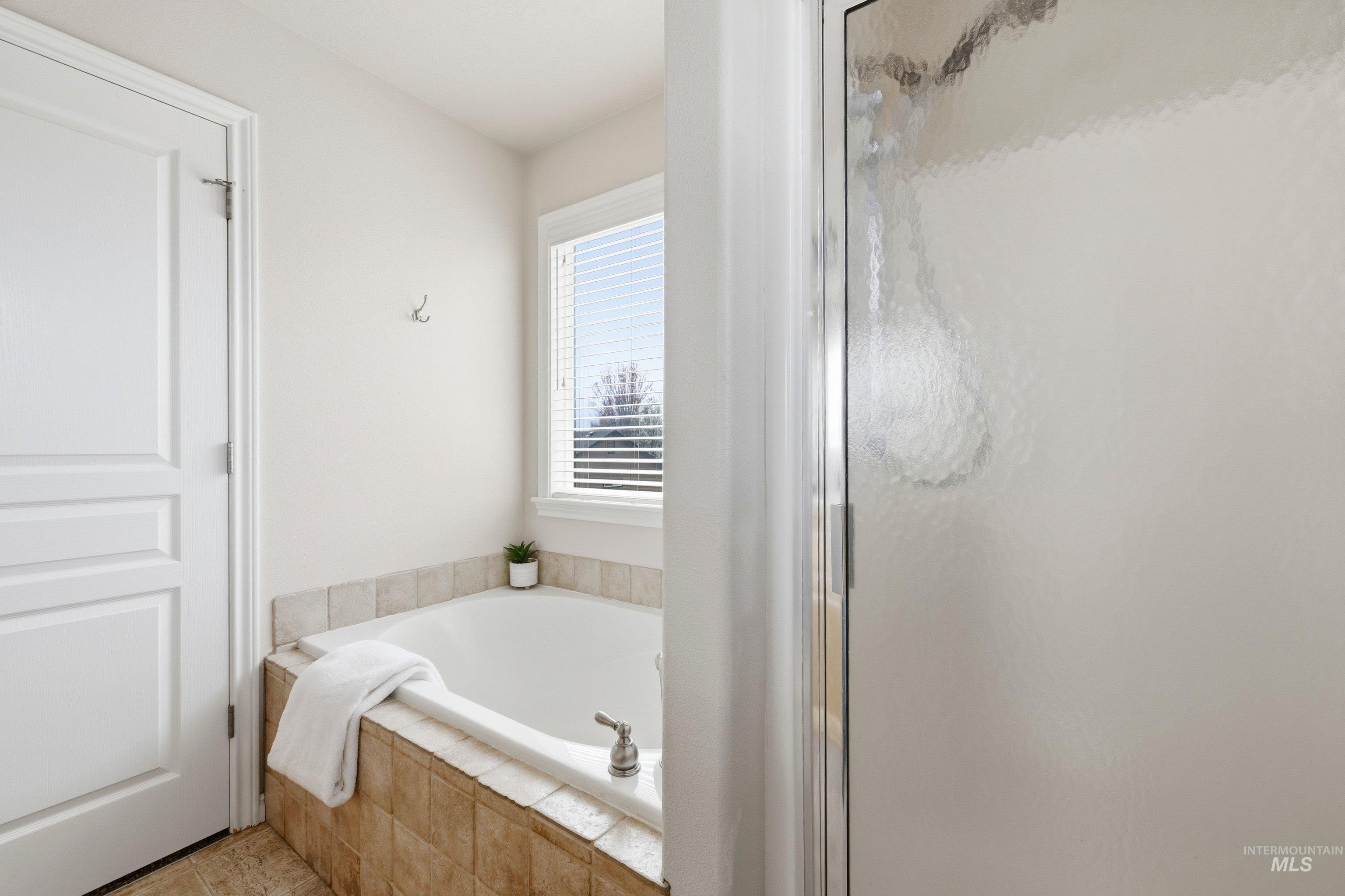 3787 North Alexis Way Meridian, ID 83646 - Photo 33 of 50 Bathroom with a bath and a shower stall