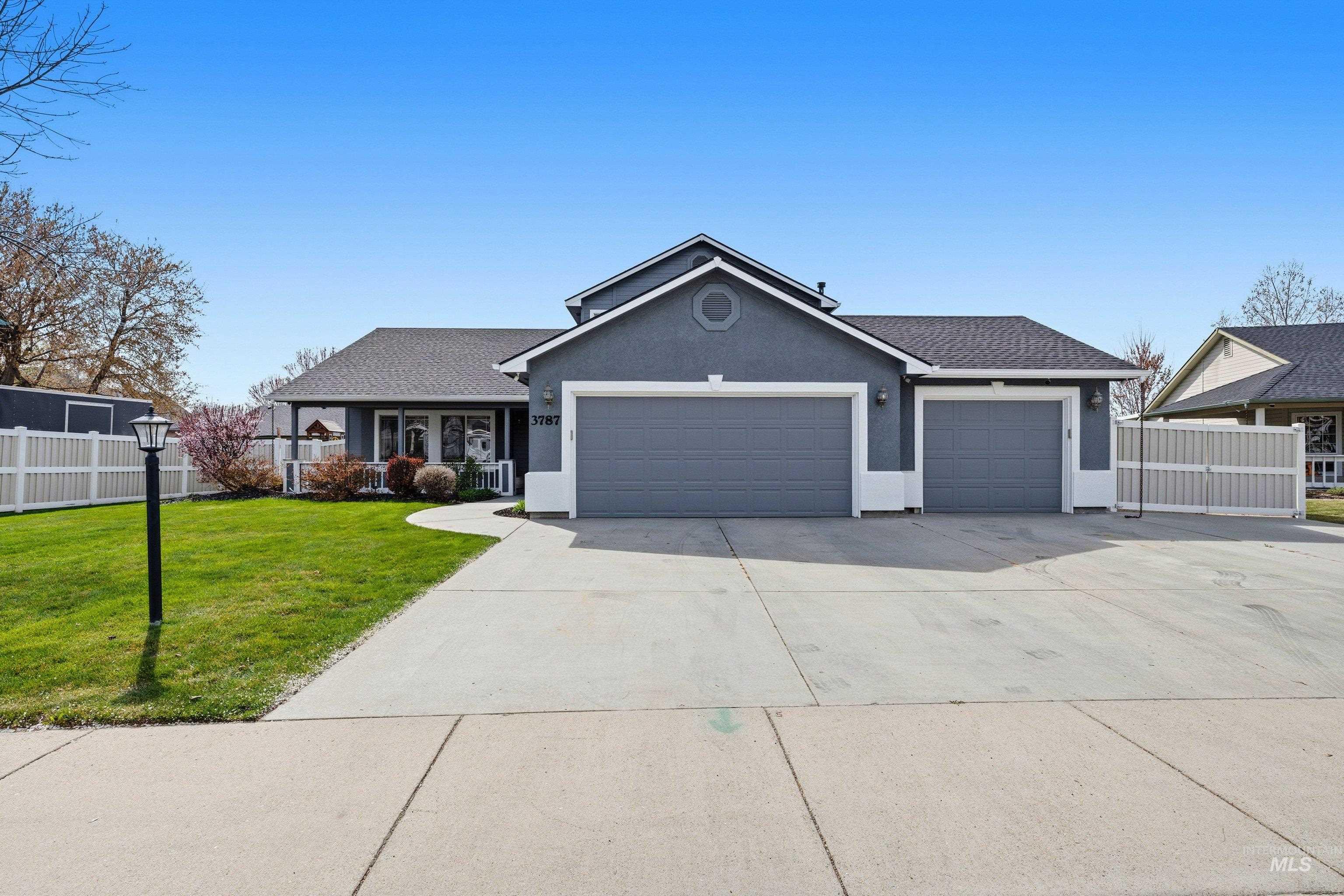 3787 North Alexis Way Meridian, ID 83646 - Photo 4 of 50 Single story home featuring an attached garage, stucco siding, driveway, and roof with shingles
