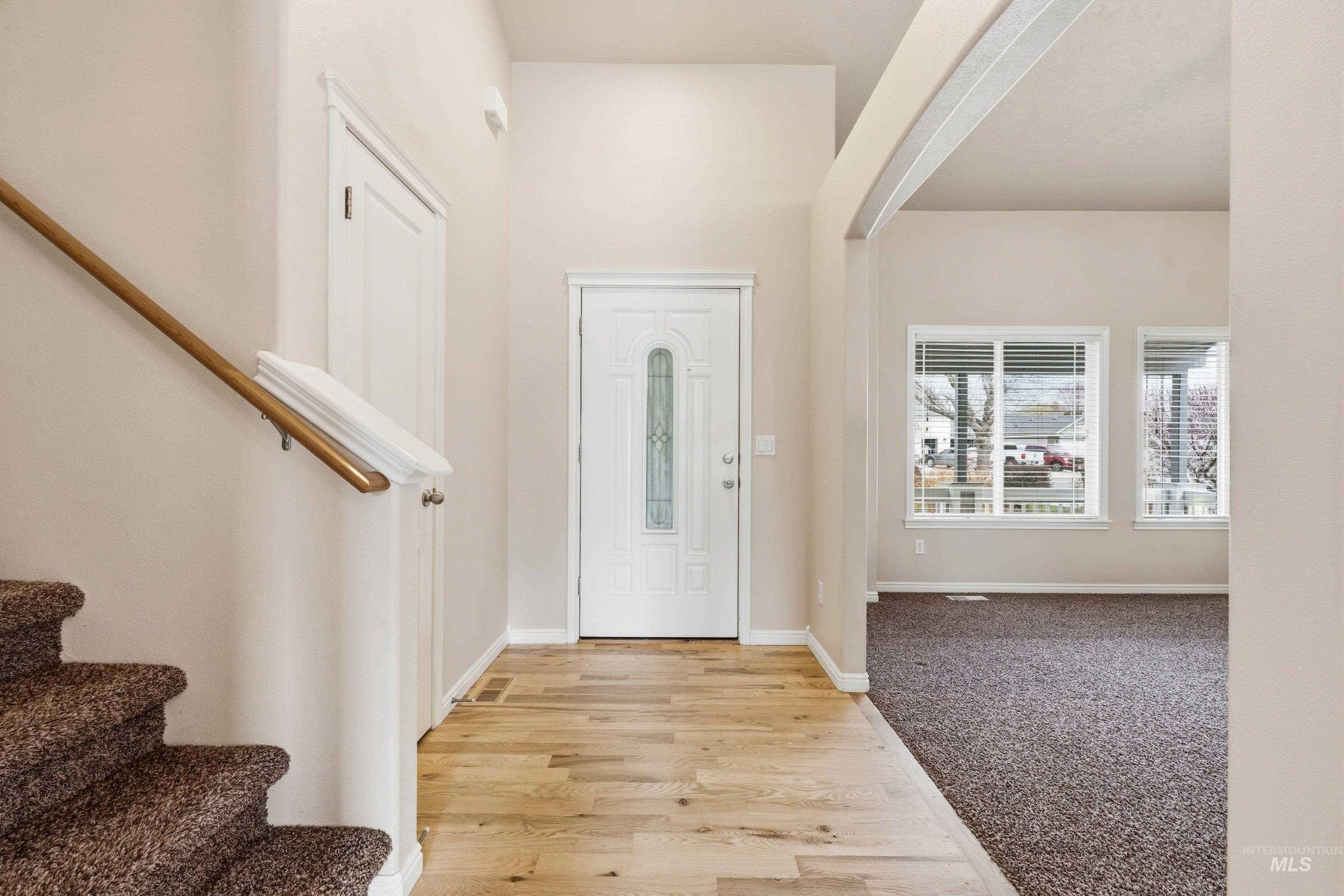3787 North Alexis Way Meridian, ID 83646 - Photo 6 of 50 Entryway featuring light wood-style floors and light carpet