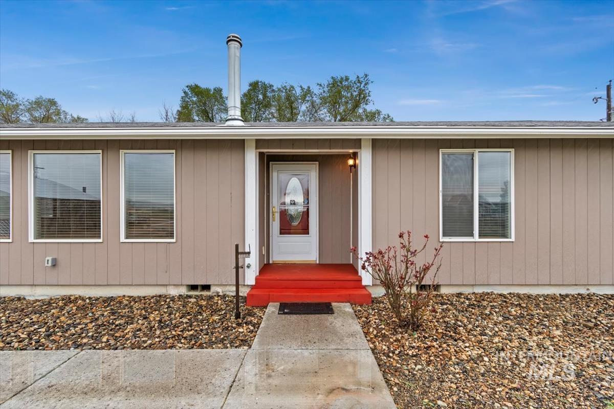 1051 Haas Road Weiser, ID 83672 - Photo 2 of 44 View of exterior entry with crawl space and a shingled roof