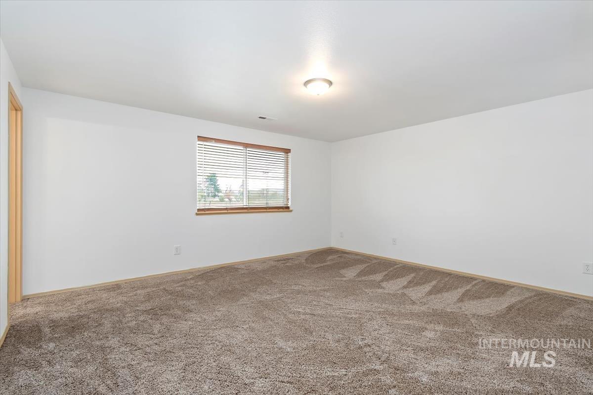 1051 Haas Road Weiser, ID 83672 - Photo 23 of 44 Unfurnished room featuring carpet flooring and baseboards