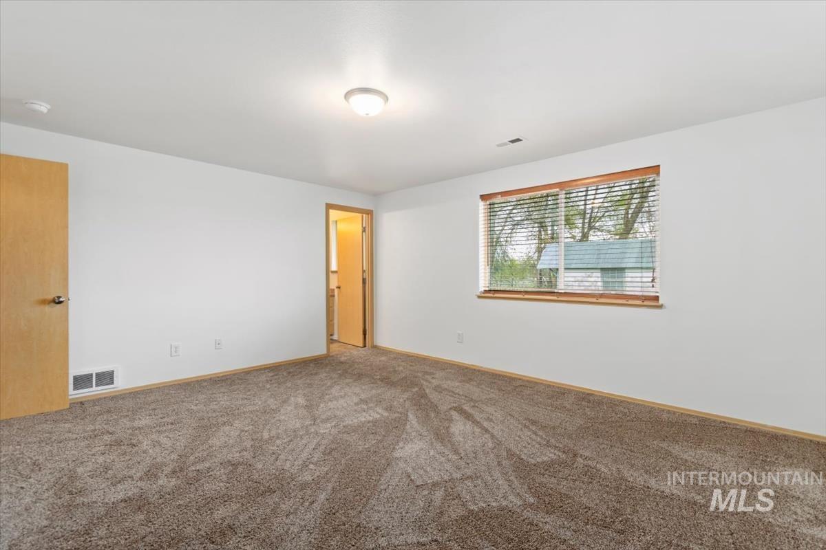 1051 Haas Road Weiser, ID 83672 - Photo 25 of 44 Carpeted empty room with baseboards
