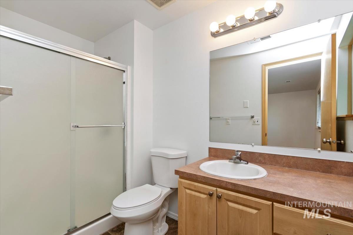 1051 Haas Road Weiser, ID 83672 - Photo 27 of 44 Full bathroom featuring vanity and a stall shower