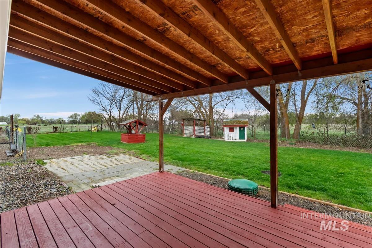 1051 Haas Road Weiser, ID 83672 - Photo 31 of 44 Wooden deck featuring a fenced backyard and an outdoor structure