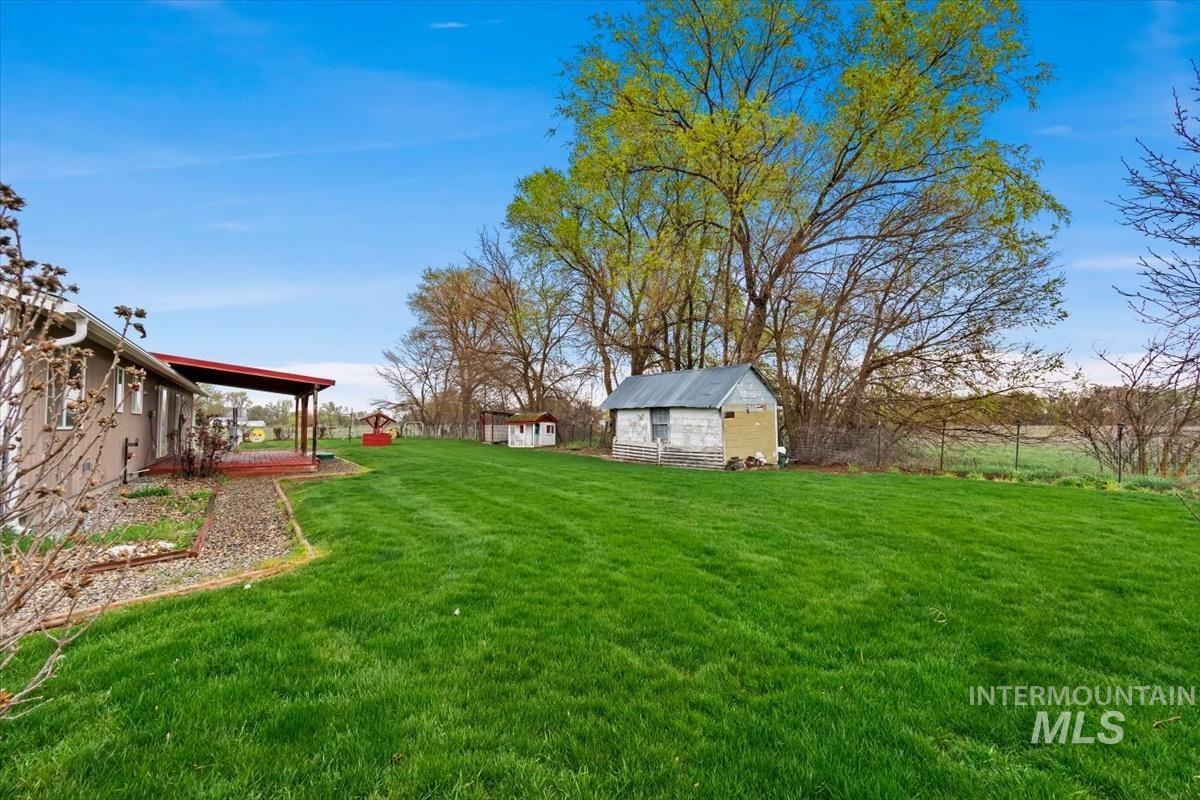 1051 Haas Road Weiser, ID 83672 - Photo 35 of 44 View of grassy yard featuring an outdoor structure