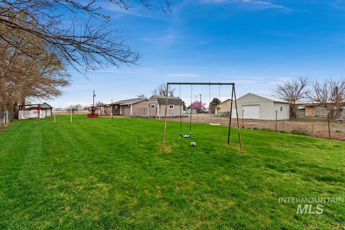 1051 Haas Road Weiser, ID 83672 - Photo 37 of 44 View of yard featuring a residential view and a garage