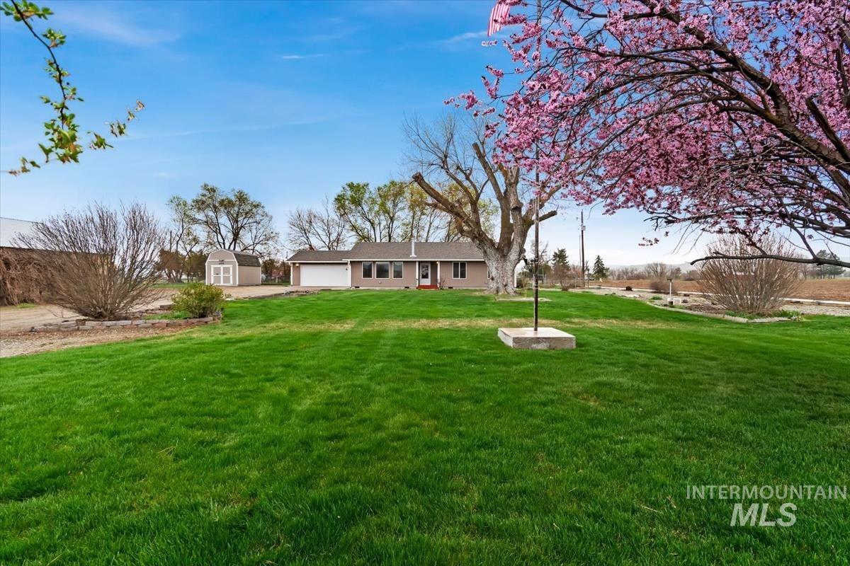 1051 Haas Road Weiser, ID 83672 - Photo 41 of 44 View of grassy yard with a storage unit and driveway