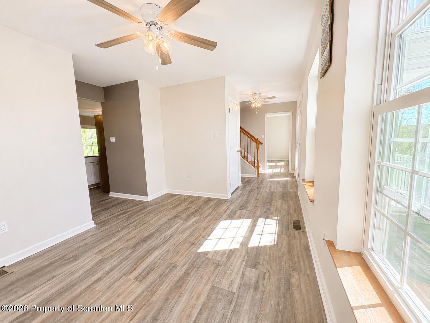 155 Baylor Road Nicholson, PA 18446 - Photo 36 of 53 a view of empty room with wooden floor and fan