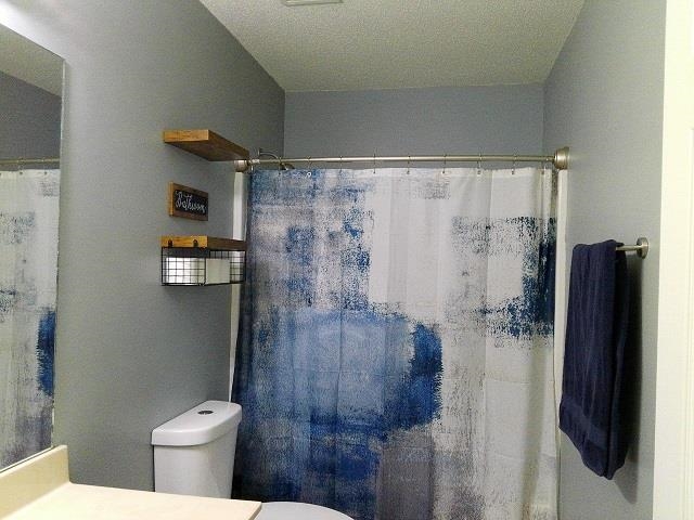 4356 Cedar Hills Road Memphis, TN 38135 - Photo 11 of 18 a bathroom with a shower and a toilet
