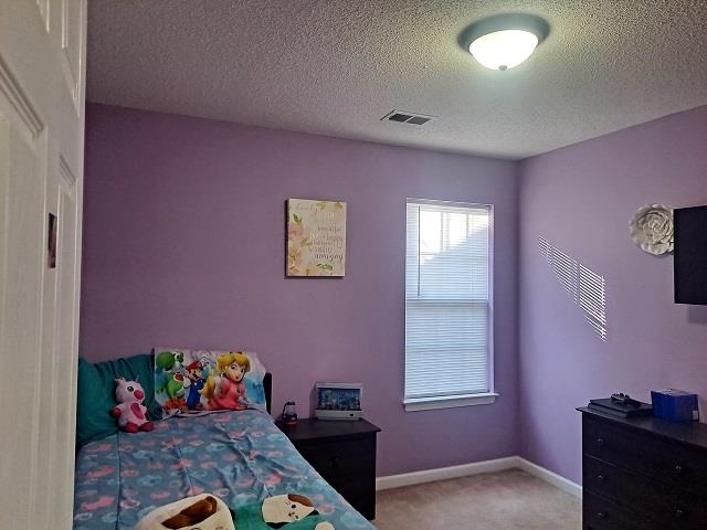 4356 Cedar Hills Road Memphis, TN 38135 - Photo 13 of 18 a bedroom with furniture and a window