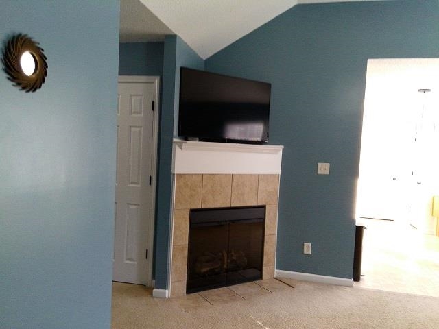 4356 Cedar Hills Road Memphis, TN 38135 - Photo 9 of 18 a living room with a fireplace and a flat screen tv