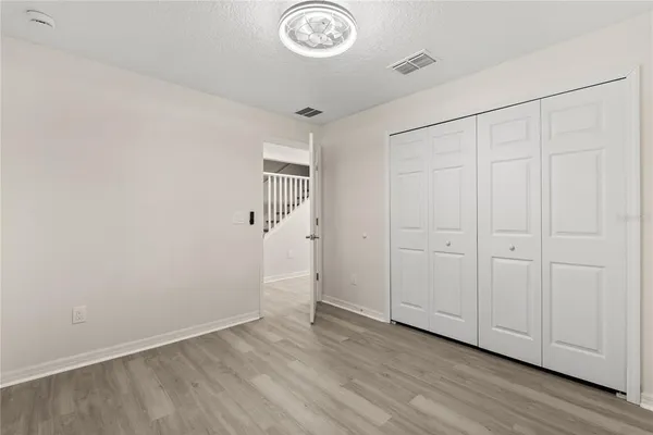 a view of a hallway with closet area