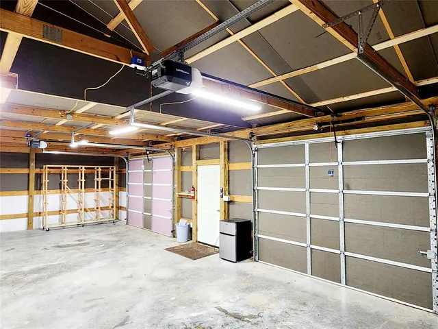 a view of empty room with wooden ceiling