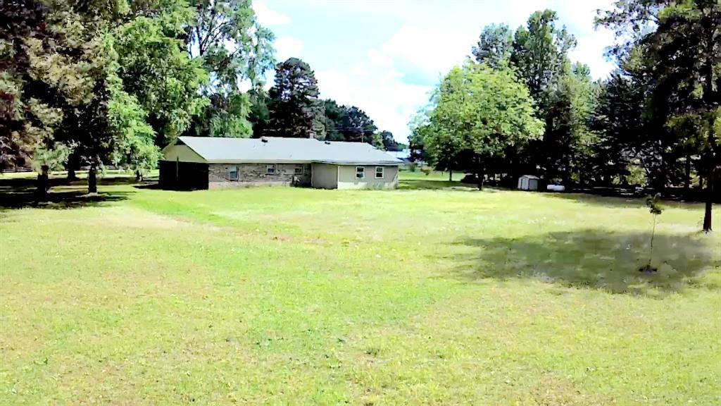 3514 Buchanan Loop Road Texarkana, TX 75501 - Photo 35 of 38 a view of a house with a yard and garage