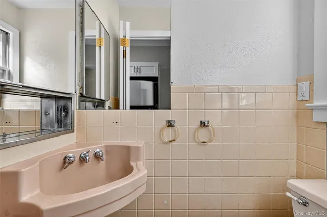 a bathroom with a bathtub and a sink