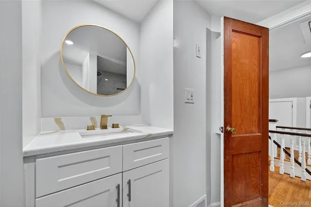 a bathroom with a sink and a mirror