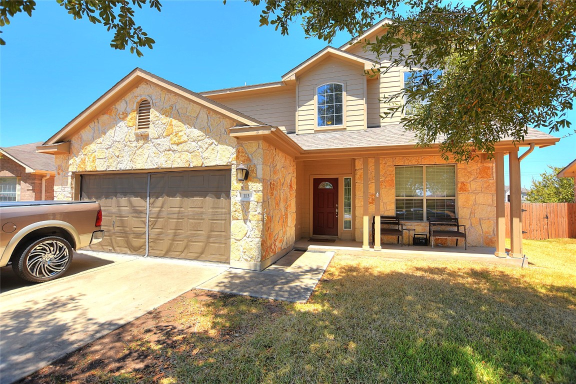 a front view of a house with a yard