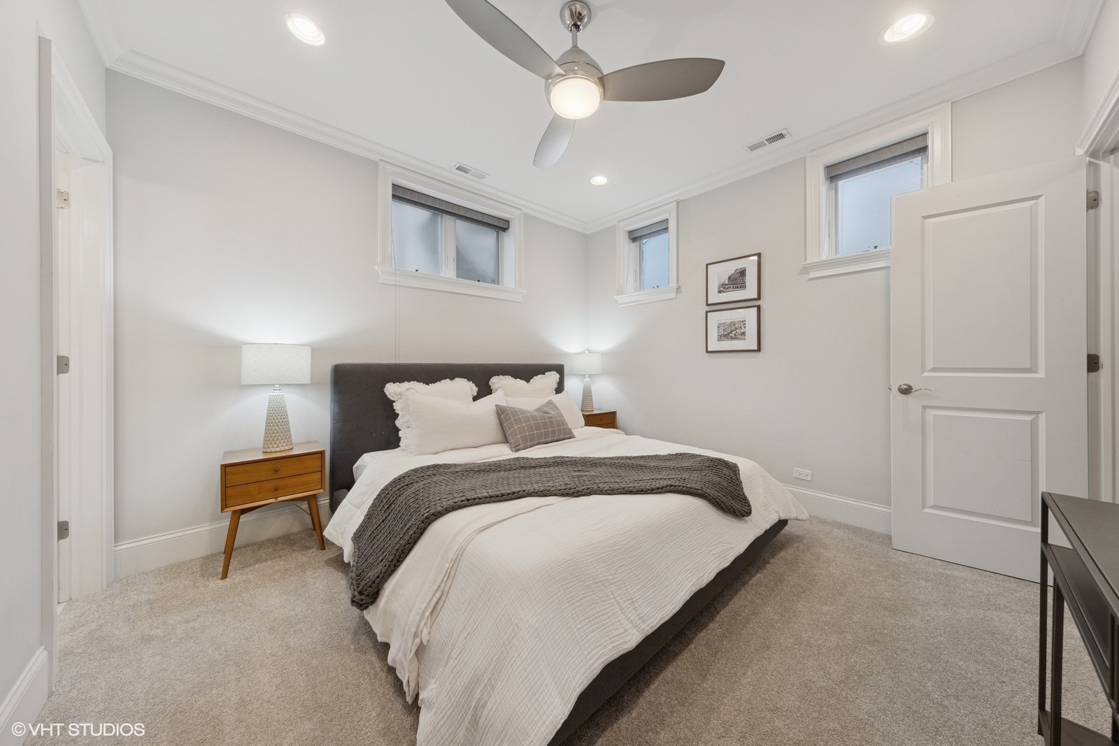 1833 West Addison Street, Unit 1S Chicago, IL 60613 - Photo 12 of 21 a bedroom with bed and a chandelier