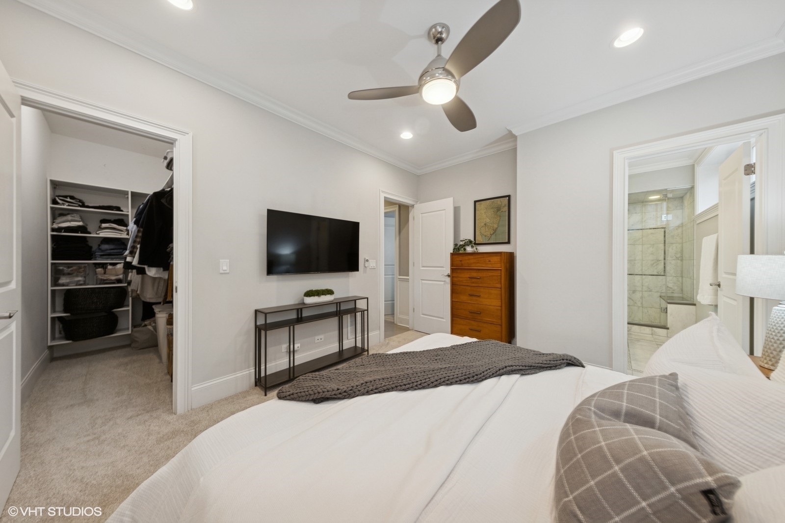 1833 West Addison Street, Unit 1S Chicago, IL 60613 - Photo 13 of 21 a bedroom with a bed and a flat screen tv