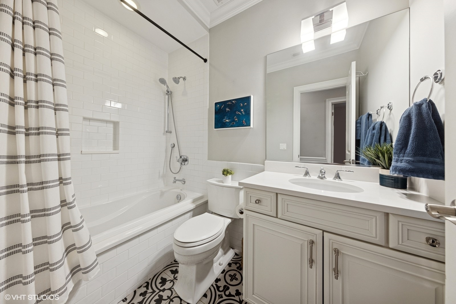 1833 West Addison Street, Unit 1S Chicago, IL 60613 - Photo 16 of 21 a bathroom with a toilet sink and mirror