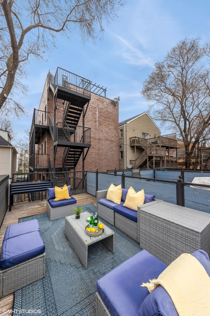 1833 West Addison Street, Unit 1S Chicago, IL 60613 - Photo 19 of 21 a outdoor space with patio couches and a potted plant on a table