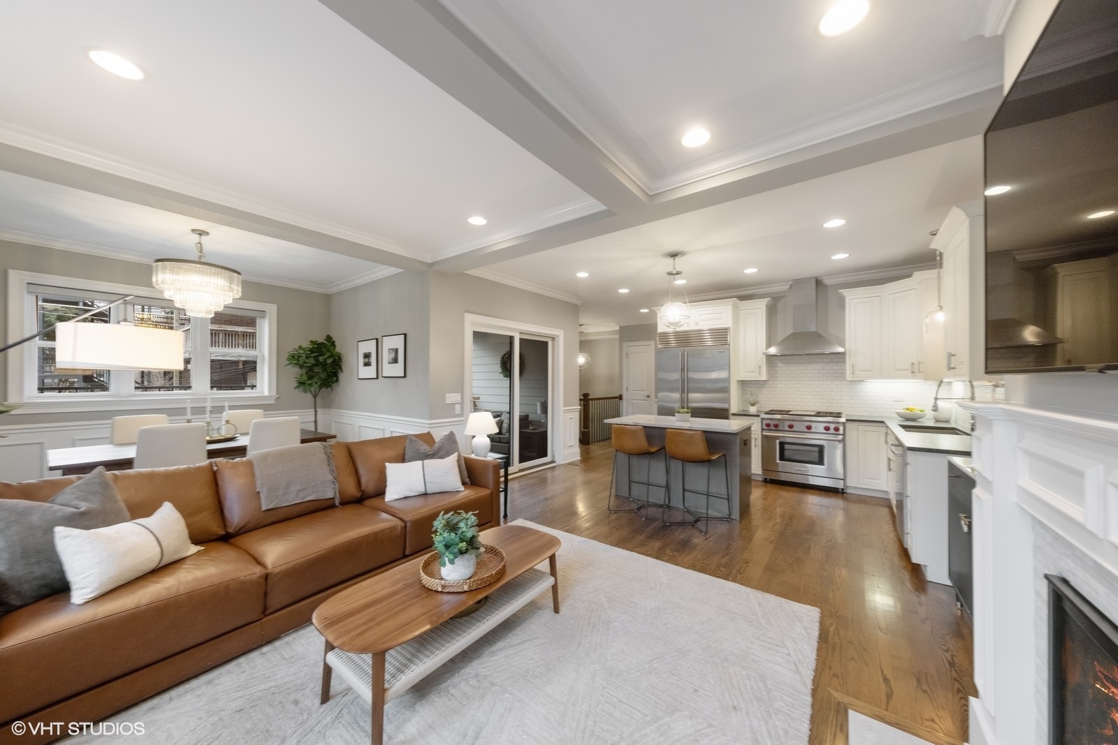 1833 West Addison Street, Unit 1S Chicago, IL 60613 - Photo 2 of 21 a large living room with stainless steel appliances kitchen view and a couch