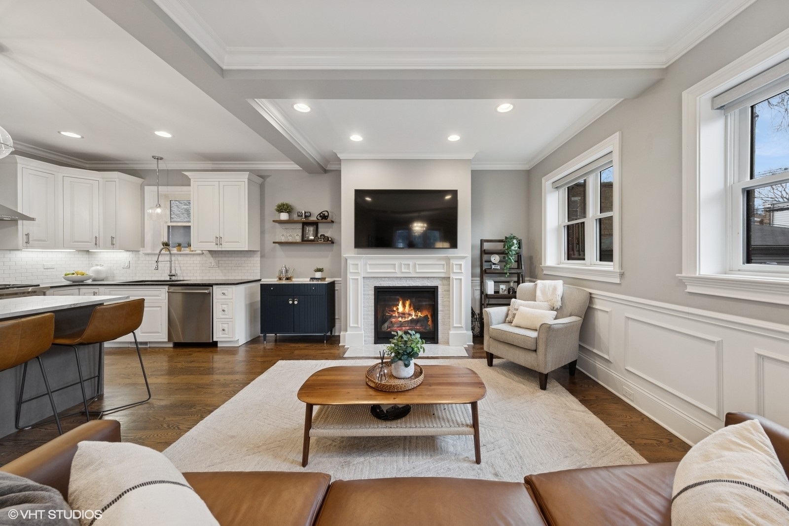 1833 West Addison Street, Unit 1S Chicago, IL 60613 - Photo 3 of 21 a living room with furniture a fireplace and a flat screen tv