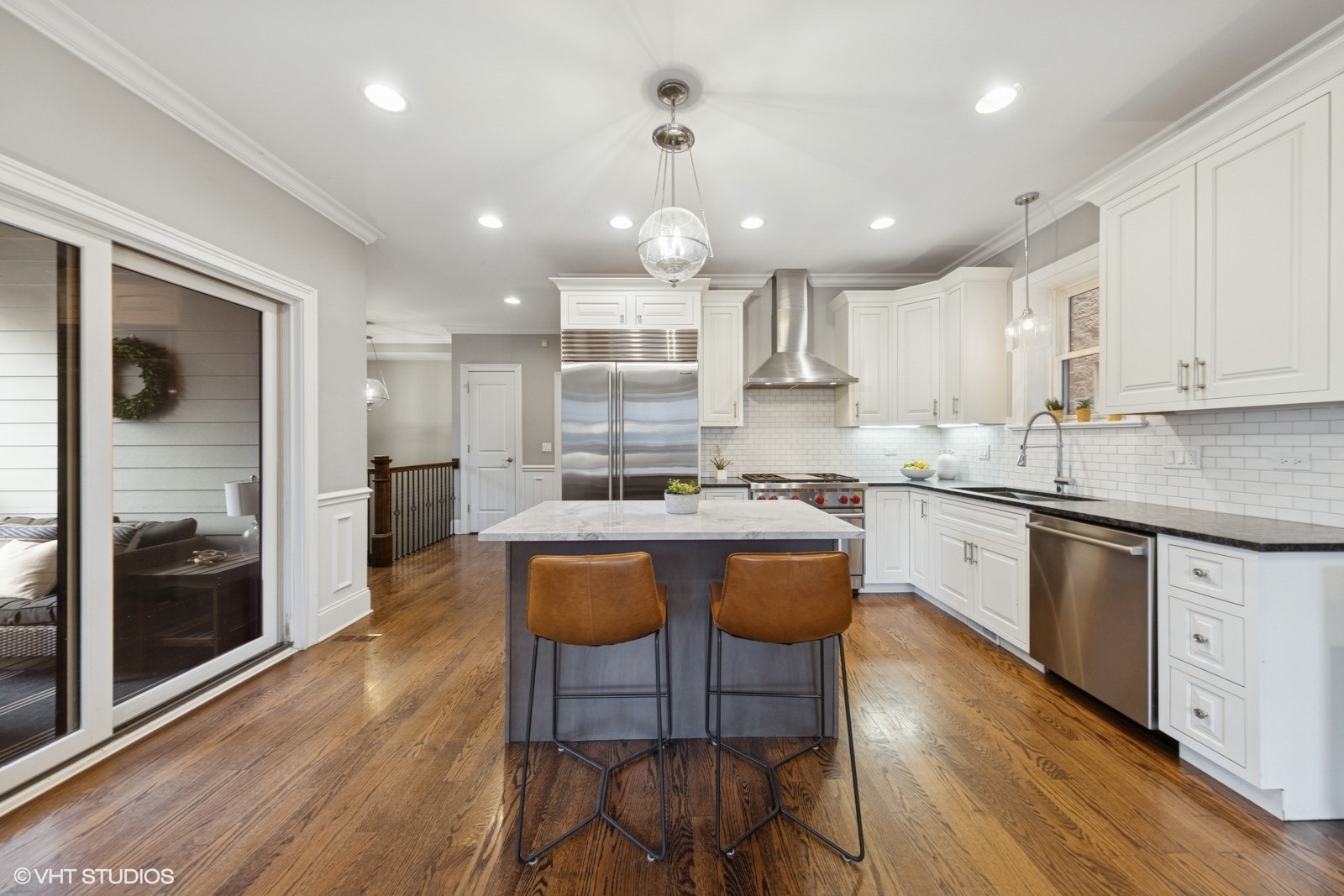 1833 West Addison Street, Unit 1S Chicago, IL 60613 - Photo 4 of 21 a kitchen with stainless steel appliances granite countertop a stove top oven a sink refrigerator and cabinets