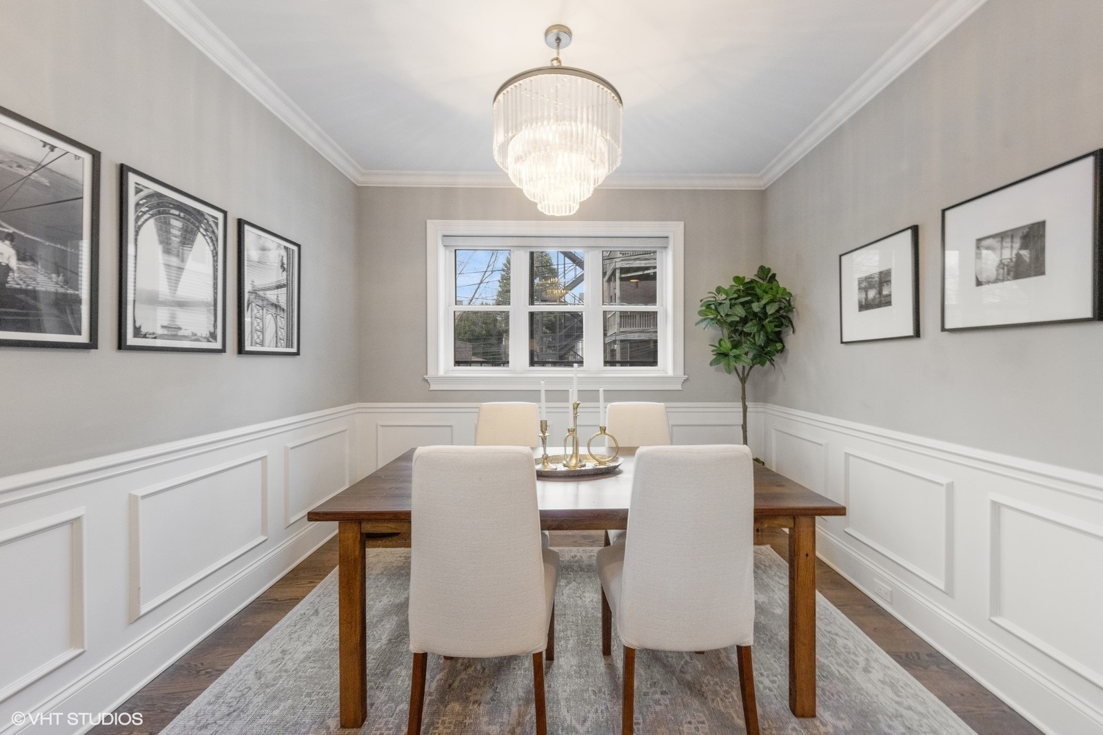 1833 West Addison Street, Unit 1S Chicago, IL 60613 - Photo 6 of 21 a view of a dining room with furniture a chandelier and wooden floor