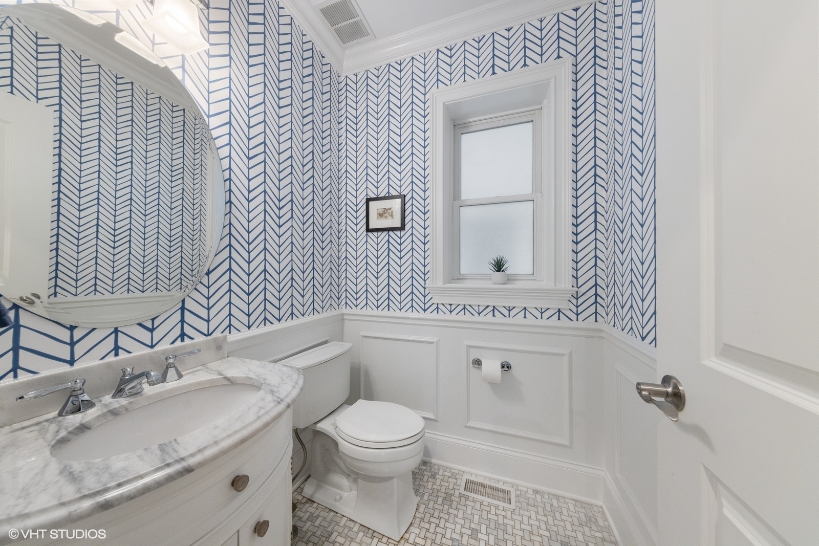 1833 West Addison Street, Unit 1S Chicago, IL 60613 - Photo 10 of 21 a bathroom with a granite countertop toilet sink and mirror