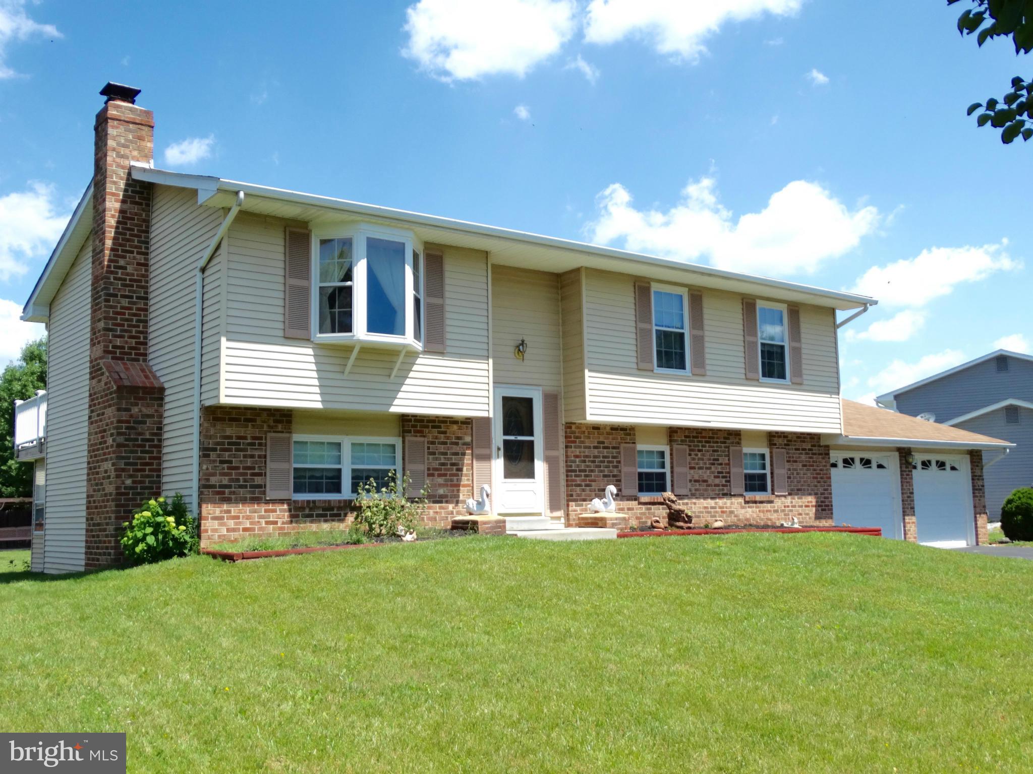 8204 Grainfield Road Severn, MD 21144 - Photo 1 of 30 a view of a house with a yard and sitting area