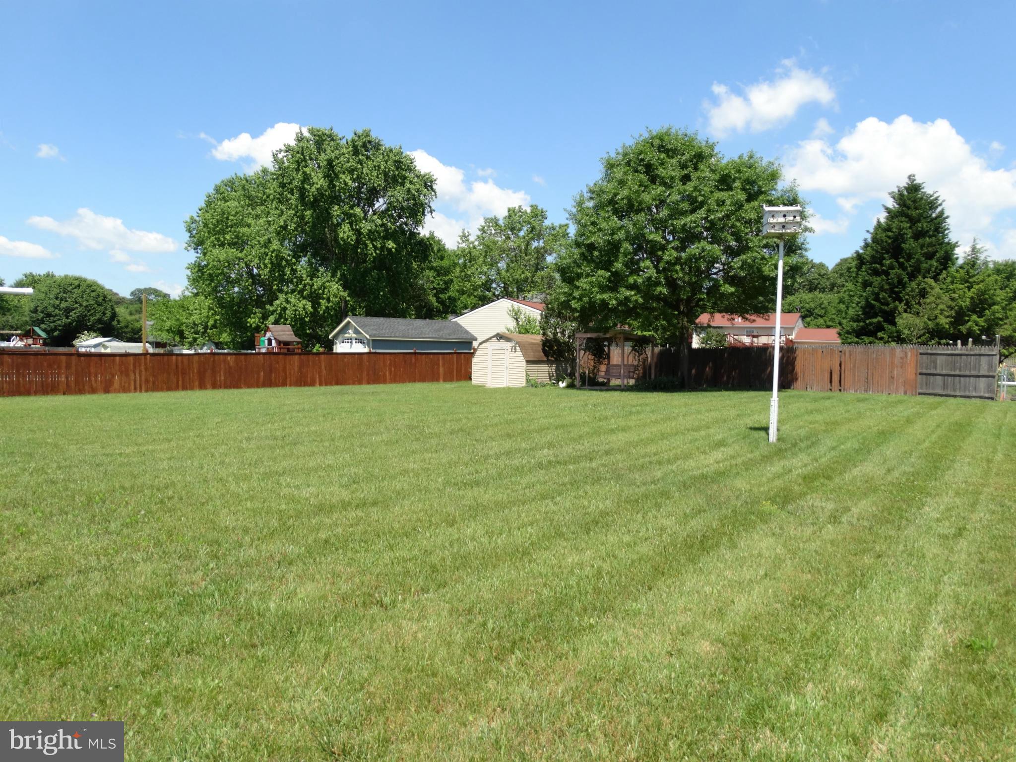 8204 Grainfield Road Severn, MD 21144 - Photo 2 of 30 a house with swimming pool in front of it