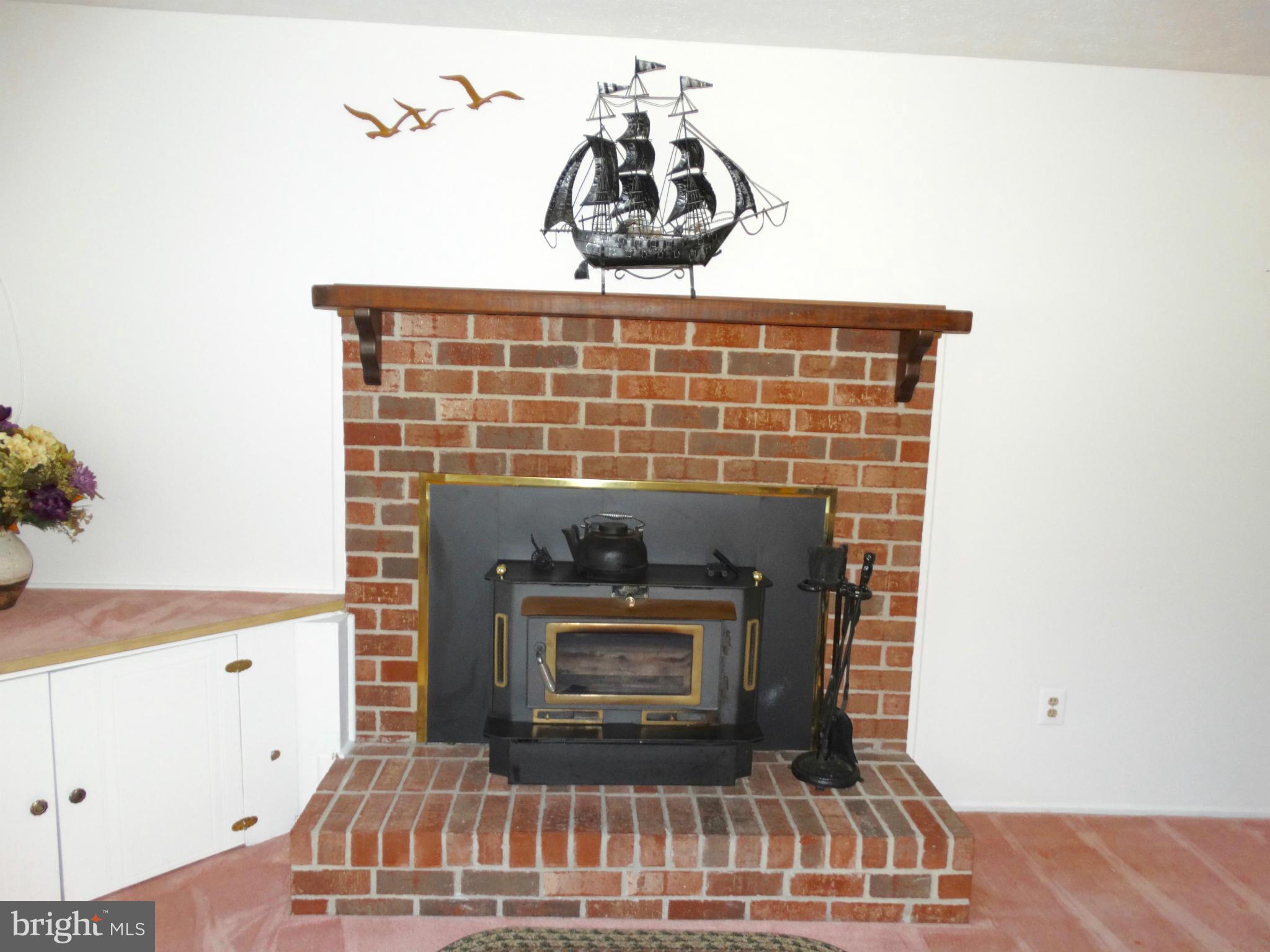 8204 Grainfield Road Severn, MD 21144 - Photo 16 of 30 a table with a fireplace
