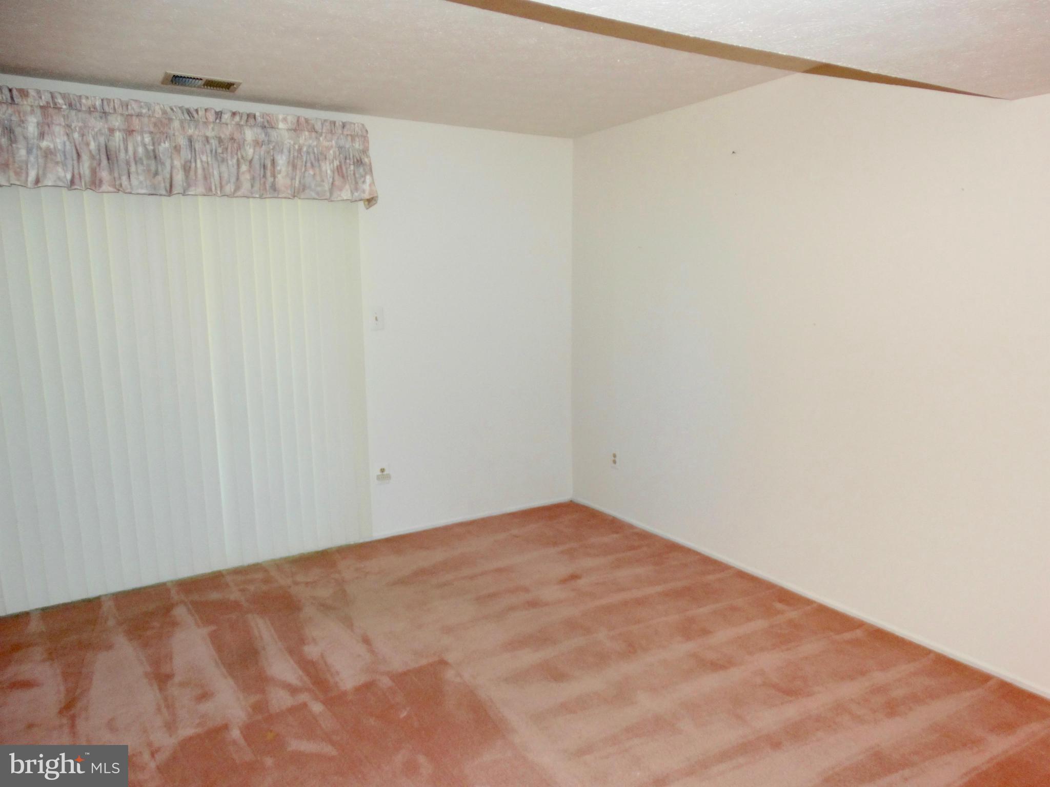 8204 Grainfield Road Severn, MD 21144 - Photo 17 of 30 a view of a room with a wooden floor and a window