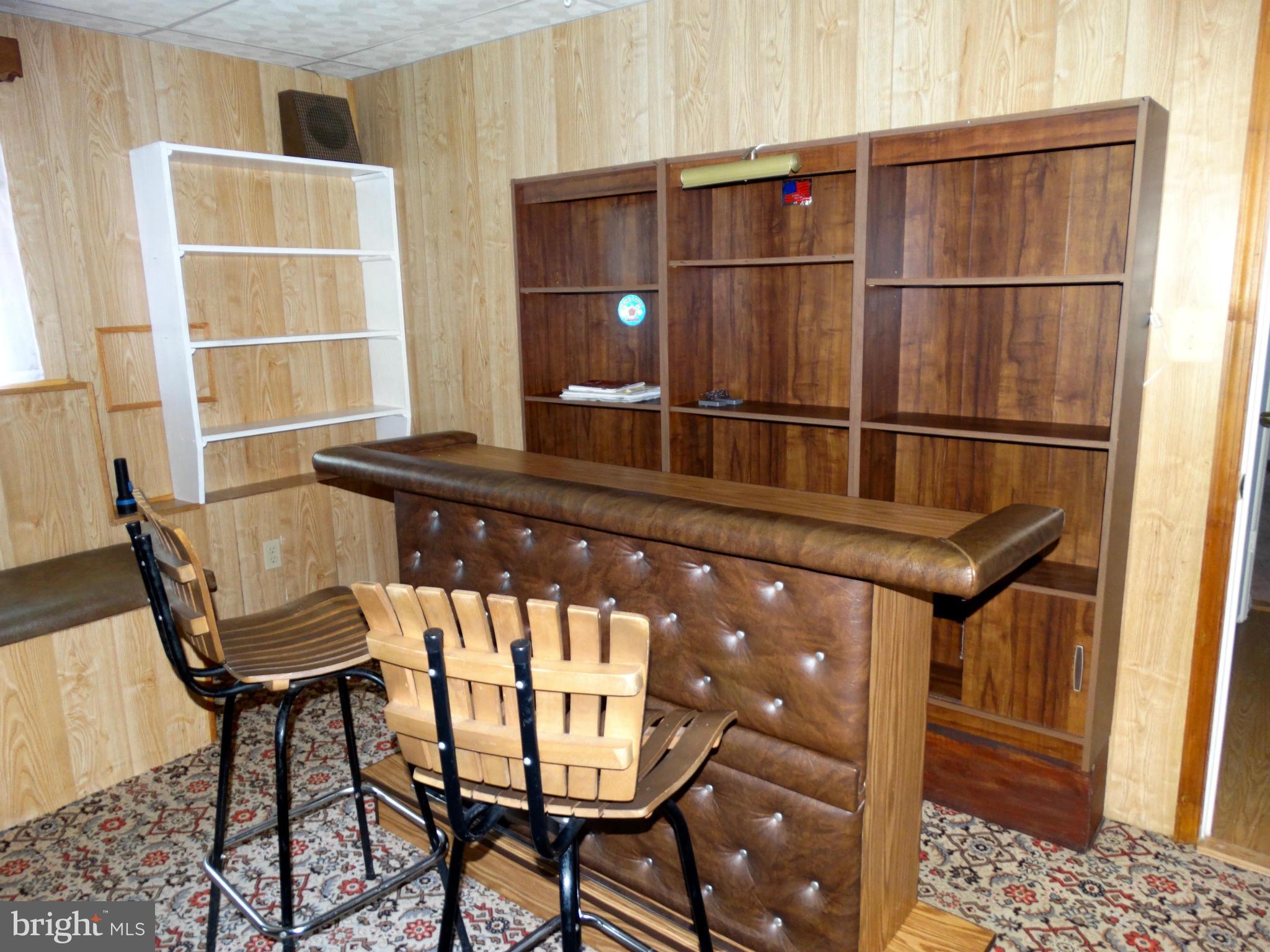 8204 Grainfield Road Severn, MD 21144 - Photo 19 of 30 a room with furniture a window and wooden floor