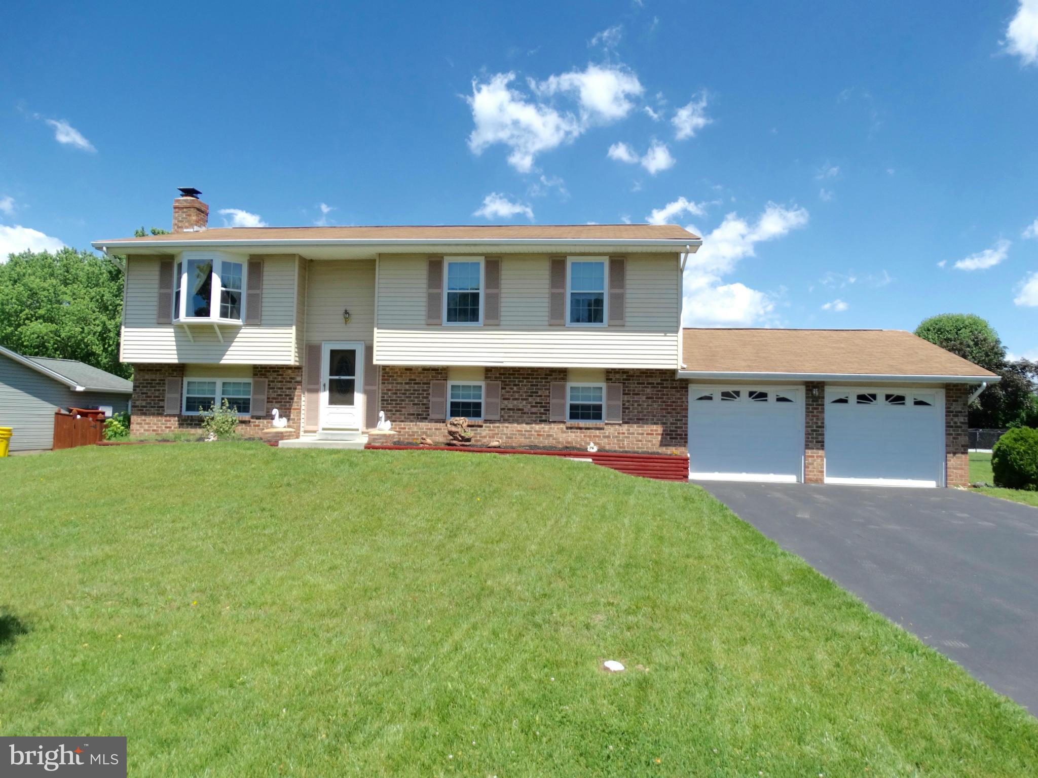 8204 Grainfield Road Severn, MD 21144 - Photo 29 of 30 a front view of house with yard and outdoor seating