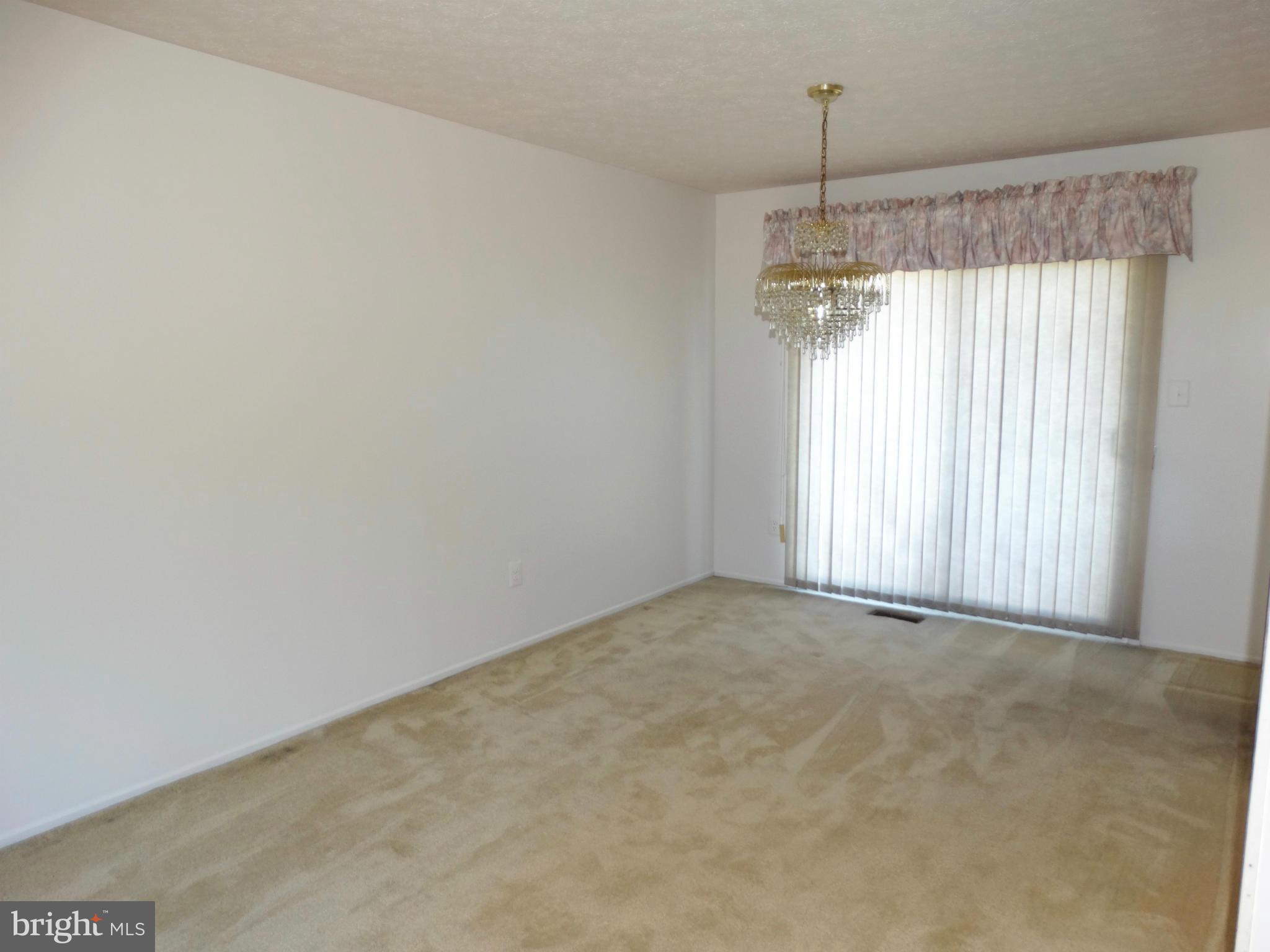 8204 Grainfield Road Severn, MD 21144 - Photo 7 of 30 a view of an empty room with a window