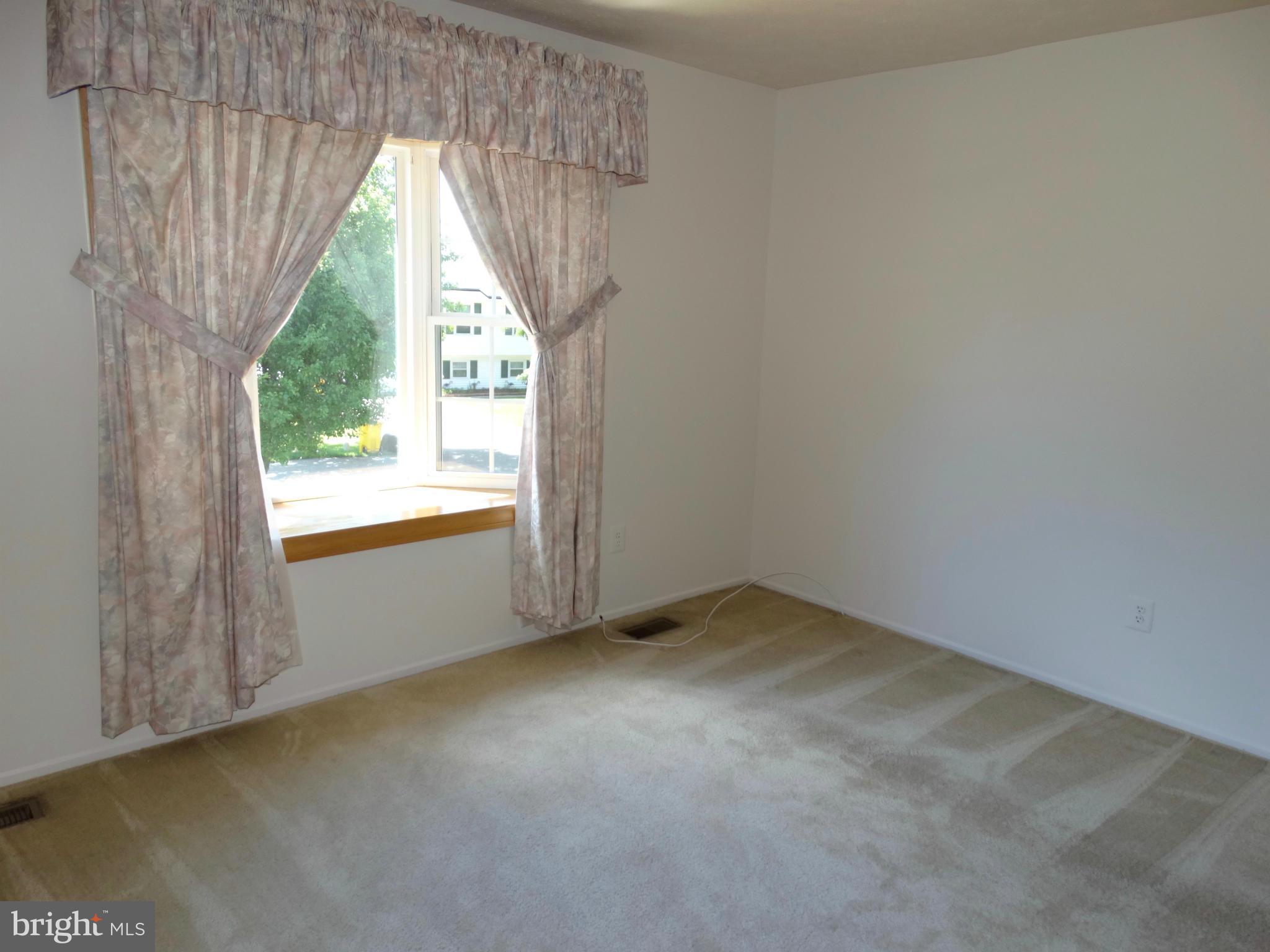8204 Grainfield Road Severn, MD 21144 - Photo 8 of 30 a view of an empty room and window