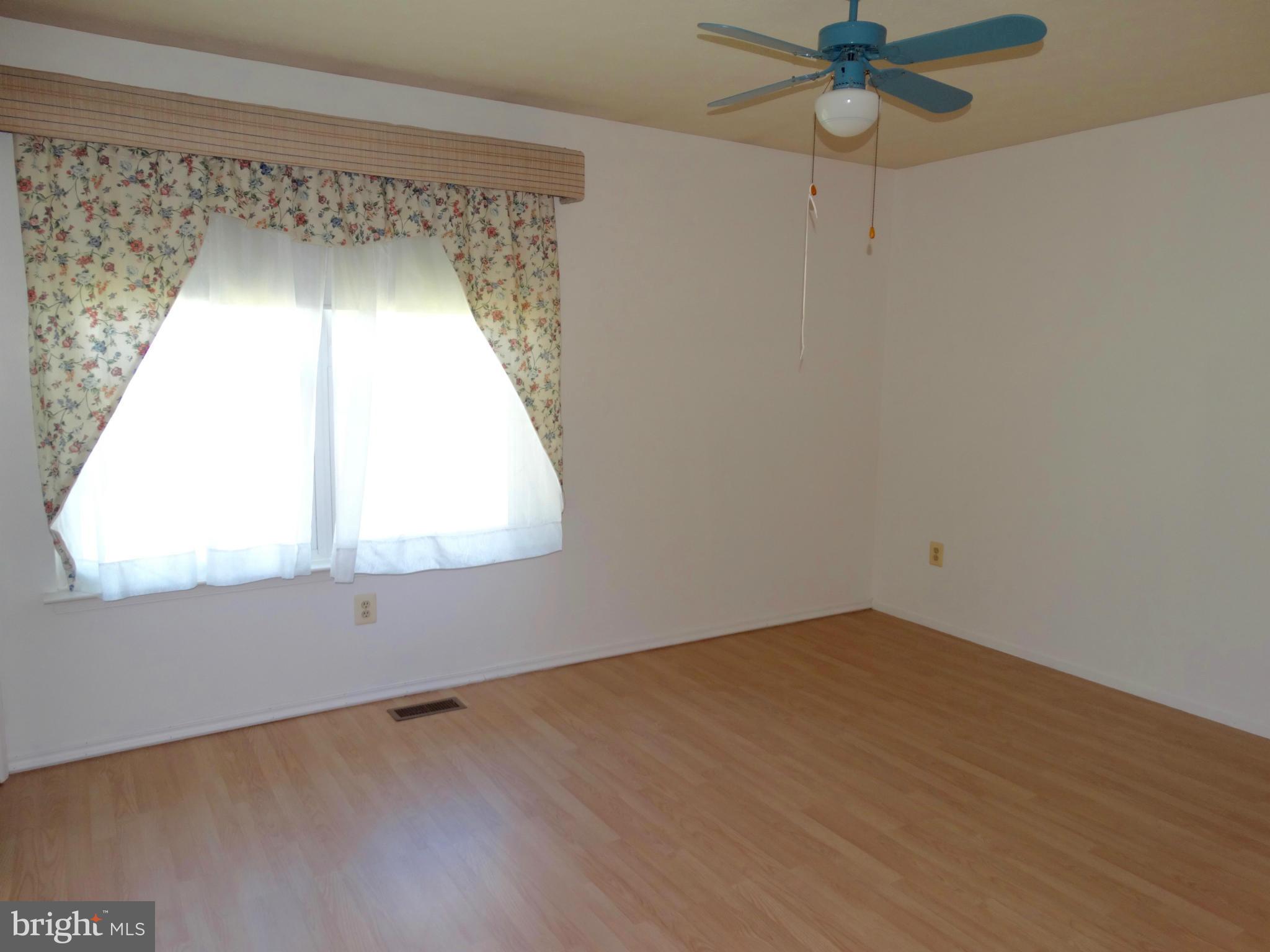 8204 Grainfield Road Severn, MD 21144 - Photo 9 of 30 an empty room with a window