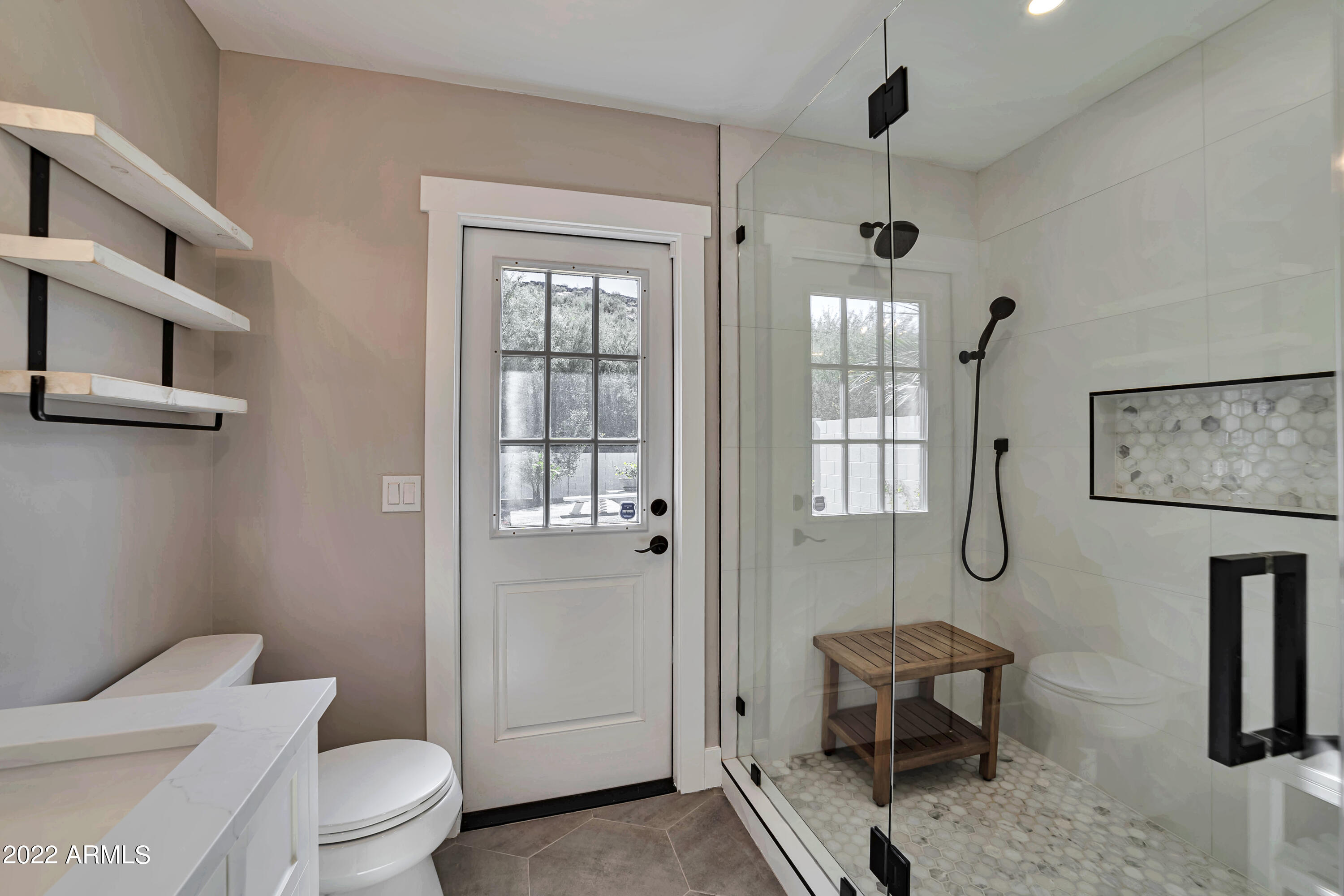 1641 West Evans Drive Phoenix, AZ 85023 - Photo 11 of 52 a bathroom with a toilet sink and shower