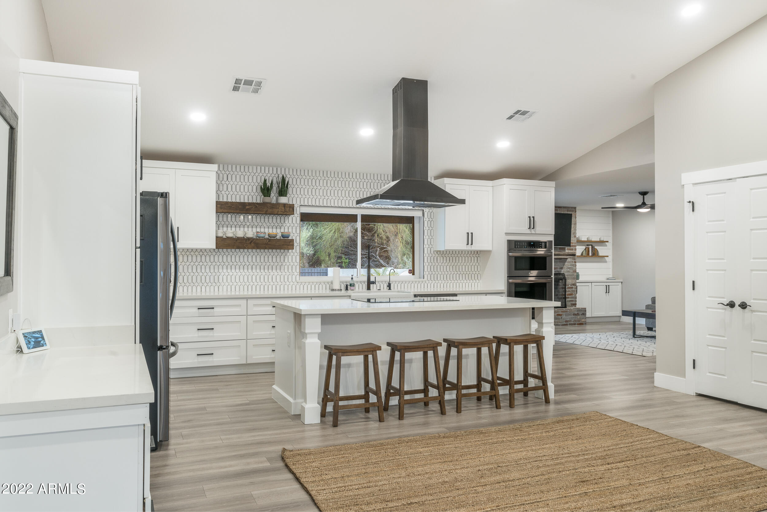 1641 West Evans Drive Phoenix, AZ 85023 - Photo 16 of 52 a kitchen with stainless steel appliances a refrigerator and a stove top oven