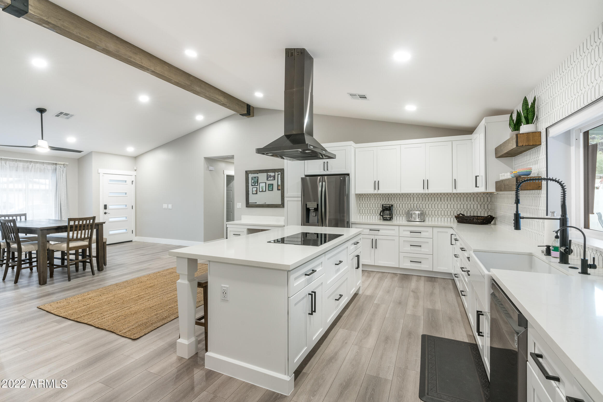 1641 West Evans Drive Phoenix, AZ 85023 - Photo 21 of 52 a kitchen with a sink stainless steel appliances and white cabinets