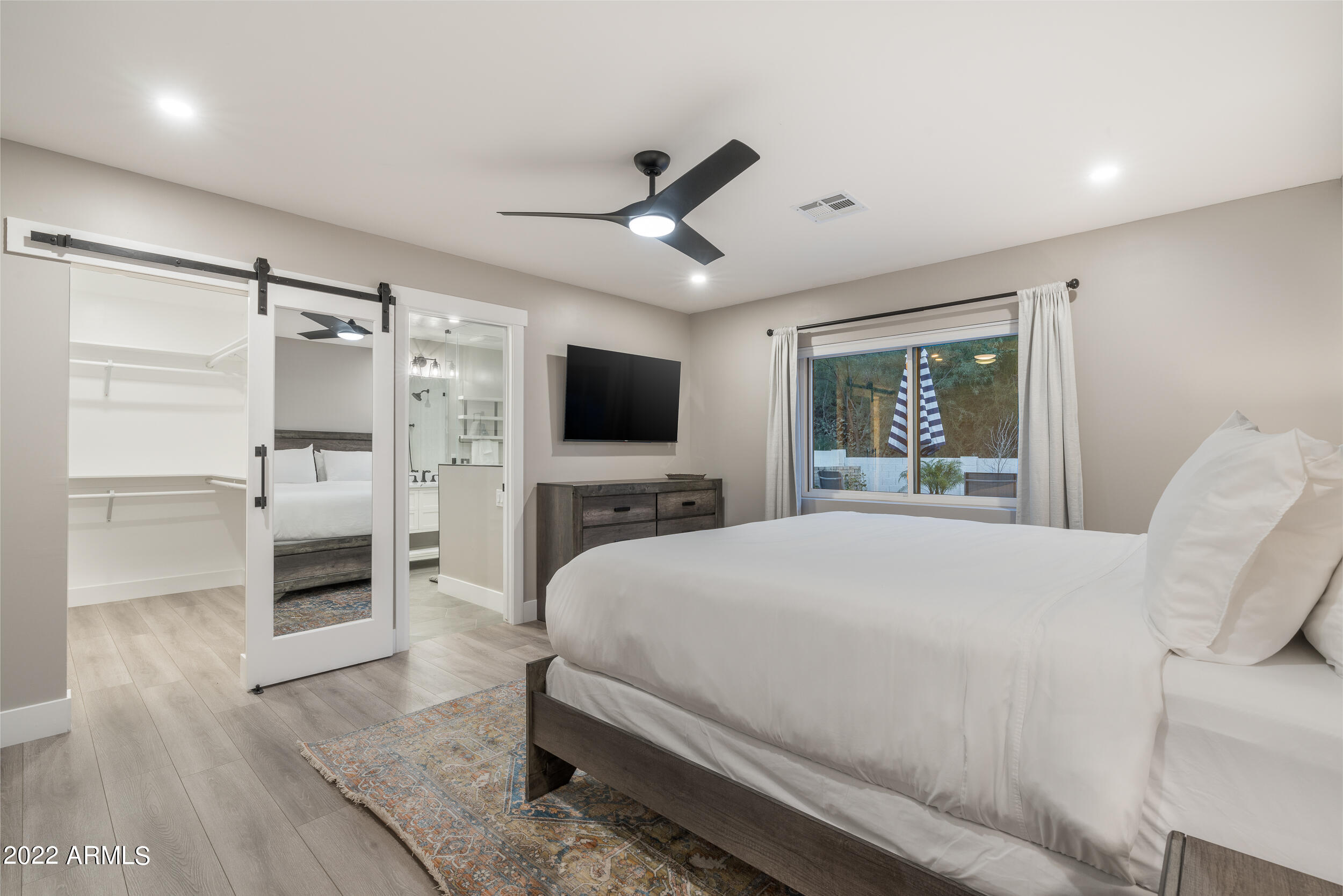 1641 West Evans Drive Phoenix, AZ 85023 - Photo 28 of 52 a bedroom with a bed and a flat screen tv