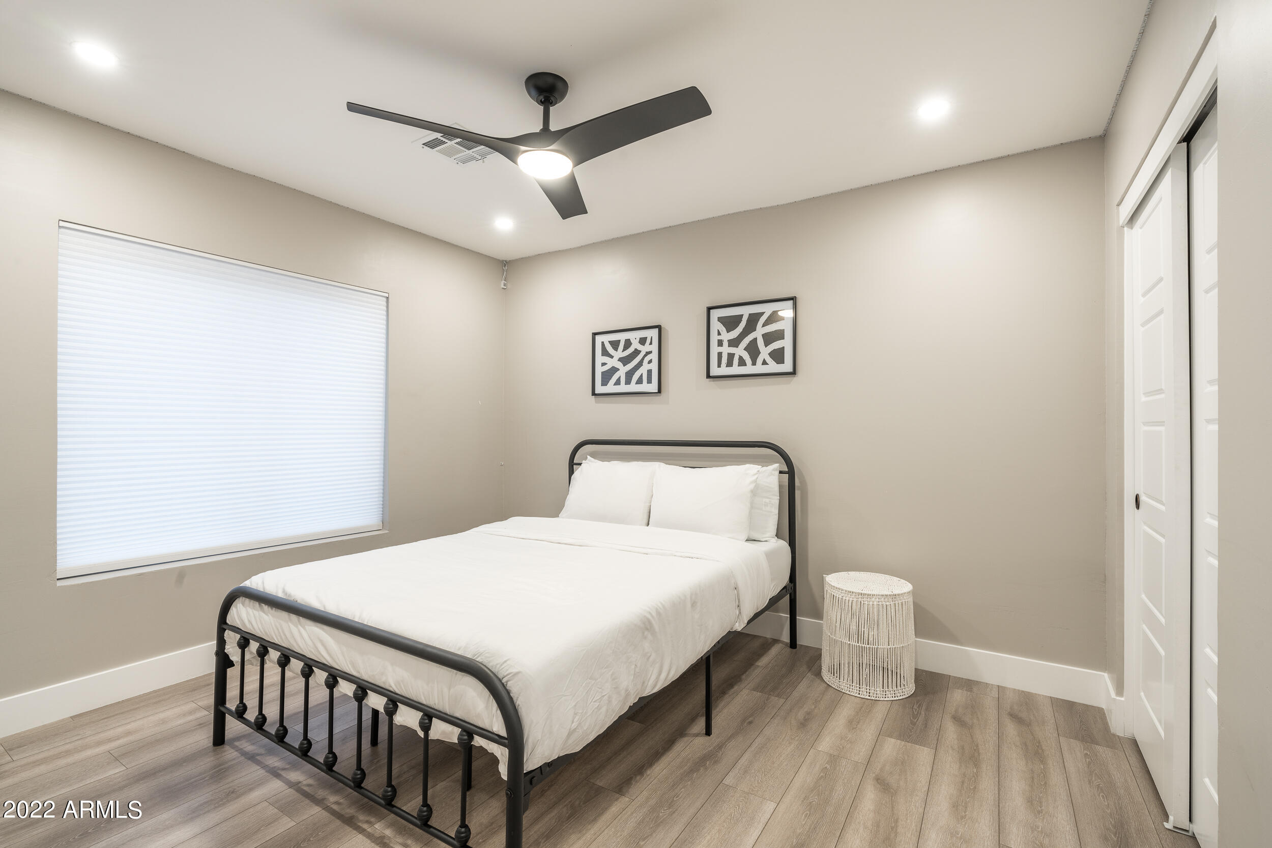 1641 West Evans Drive Phoenix, AZ 85023 - Photo 33 of 52 a bedroom with a bed and a table